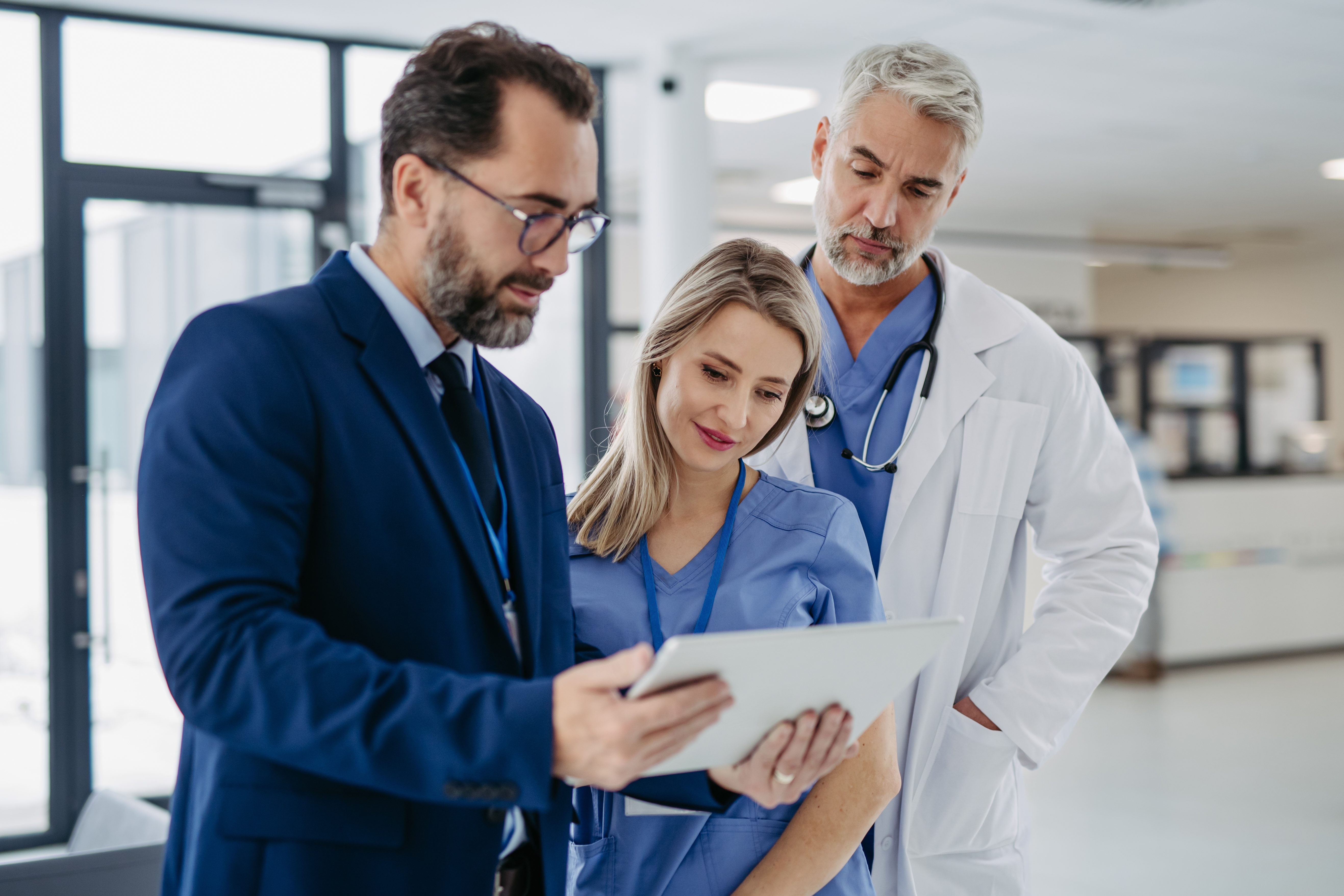 group of medical staff looking at clipboard