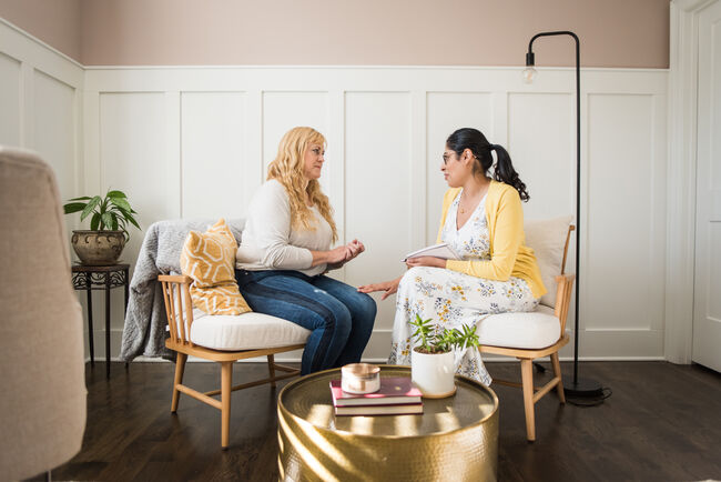 social worker speaking with woman
