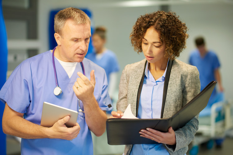 Doctor and nurse looking over a chart 