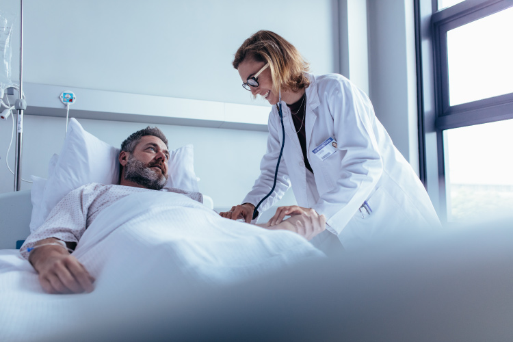 Nurse practitioner taking a patient’s vitals.