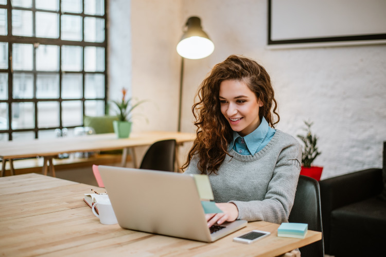 A person works at a laptop.