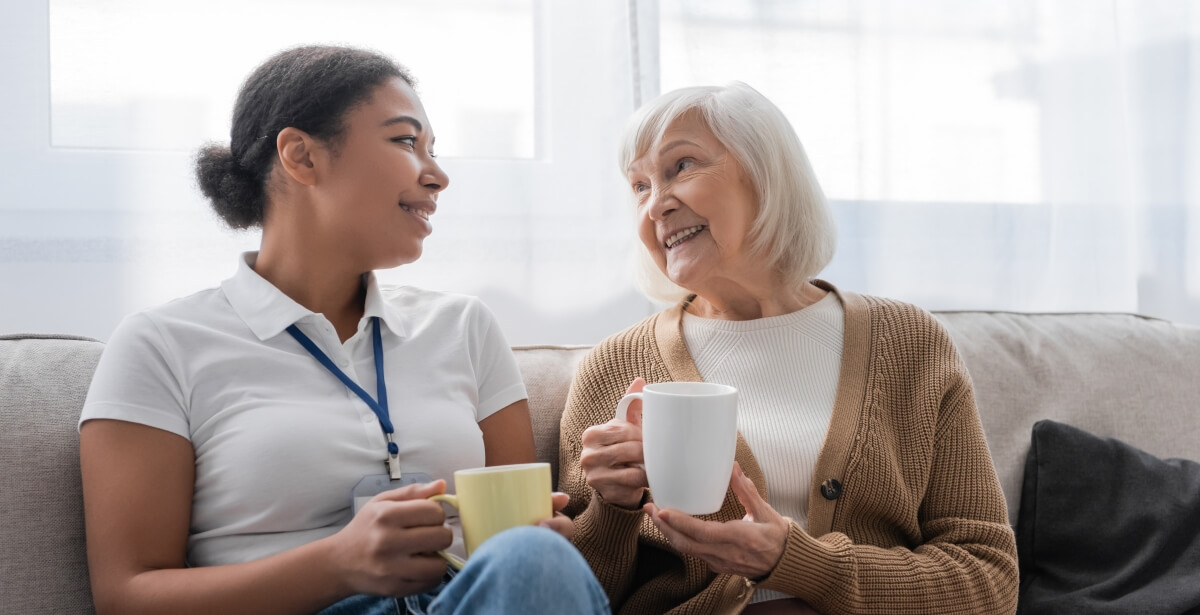 multiracial social worker having tea